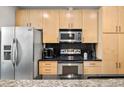 Modern kitchen with stainless steel appliances and granite countertops at 943 Peachtree Ne St # 809, Atlanta, GA 30309
