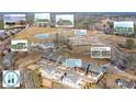Aerial view of new townhome community with various amenities at 152 Palm St, Holly Springs, GA 30115