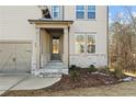 Inviting front entrance with stone accents and a covered porch at 23 Rockberry Ct, Dallas, GA 30157