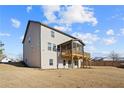 Two-story home with gray siding, large deck and screened porch at 23 Rockberry Ct, Dallas, GA 30157