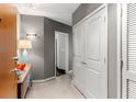 Bright entryway with wood console table and modern light fixture at 943 Peachtree Ne St # 1708, Atlanta, GA 30309