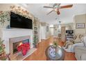 Spacious living room with hardwood floors and fireplace at 3275 Lenox Ne Rd # 206, Atlanta, GA 30324