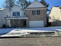 Two-story brick home with white accents and a large garage at 793 River Gardens Se Dr, Atlanta, GA 30354