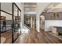 Bright entryway with hardwood floors, glass doors, and a staircase to the second floor at 2570 Reynolds Sw Rd, Atlanta, GA 30331