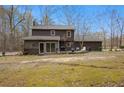 Back of house showing deck and screened porch at 114 Delta Ct, Sharpsburg, GA 30277