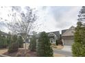 Community of gray and stone houses with manicured landscaping at 2540 Village Park Dr, Cumming, GA 30041