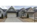 Houses with gray siding and white accents, two car garages at 2540 Village Park Dr, Cumming, GA 30041