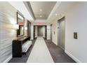 Modern hallway with elevator access and seating at 325 E Paces Ferry Ne Rd # 806, Atlanta, GA 30305