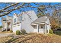 Two-story house with a white exterior, covered porch, and landscaping at 4260 Wesley Hall Dr, Decatur, GA 30035