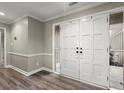 Bright entryway with hardwood floors and elegant double doors at 220 Mountain Pt, Roswell, GA 30075