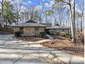 Exterior of house with stone accents and landscaping, showcasing curb appeal at 220 Mountain Pt, Roswell, GA 30075