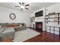 Spacious living room features a fireplace, hardwood floors, and built-in shelving at 4204 Mastic Pointe # 24, Acworth, GA 30101