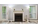Gas fireplace with white mantel in living room at 3960 Riverlook Pkwy # 101, Marietta, GA 30067