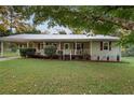 House exterior featuring a large front yard and mature trees at 52 Jennifer Ln, Carrollton, GA 30116