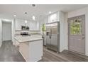 Modern kitchen with stainless steel appliances and an island at 8658 Knox Bridge Hwy, Canton, GA 30114