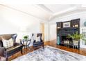 Elegant living room featuring hardwood floors, fireplace, and comfy armchairs at 1252 Mclendon Ne Ave, Atlanta, GA 30307