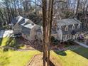 Two story home and guest house with a large backyard at 315 Brandenburgh Cir, Roswell, GA 30075