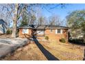 Brick ranch house with a large yard and driveway at 3542 N Druid Hill Rd, Decatur, GA 30033