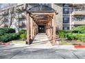 Elegant condo entry with covered walkway and stone details at 1214 Highland Bluff Se Dr # 214, Atlanta, GA 30339