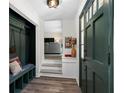 Inviting entryway with built-in bench seating and view to the living room at 3059 Trafalgar Way, Atlanta, GA 30341