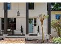 Charming front porch with a light blue door and stylish landscaping at 3059 Trafalgar Way, Atlanta, GA 30341