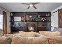 Living room boasts a fireplace, floating shelves, and a rustic barn door at 4233 Creekrun Cir, Buford, GA 30519