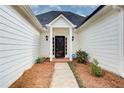 Front door of a home with a well-manicured lawn and walkway at 620 Oakledge Nw Dr, Marietta, GA 30060