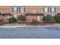 Brick townhouse exterior with landscaping and a walkway at 5667 Kingsport Dr, Atlanta, GA 30342