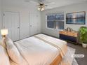 Virtually staged bedroom with lake view and ample closet space at 1043 Carriage Trace Cir, Stone Mountain, GA 30087