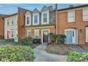 Brick townhouses with landscaping and walkway at 3495 Tulip Tree Ln, Duluth, GA 30096
