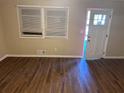 Living room with hardwood floors and open door at 3705 Daisy Dr, Decatur, GA 30032