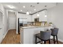 Modern kitchen with white cabinets and granite countertops at 2795 Peachtree Ne Rd # 703, Atlanta, GA 30305