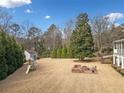 Spacious backyard with playset, shed, and fire pit area at 2440 Jamerson Rd, Marietta, GA 30066