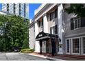 Building exterior with a striped awning and landscaping at 3648 Peachtree Ne Rd # 3J, Atlanta, GA 30319