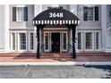 Brick building with a striped awning and steps leading to the entrance at 3648 Peachtree Ne Rd # 3J, Atlanta, GA 30319