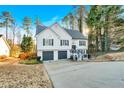 Two-story house with gray shutters, a two-car garage, and a deck at 2713 Windsor Nw Ct, Kennesaw, GA 30144