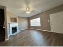 Spacious living room with fireplace and hardwood floors at 5464 Sierra Trl, College Park, GA 30349