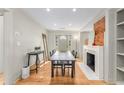 Dining room features hardwood floors and exposed brick fireplace at 2662 Memorial Se Dr, Atlanta, GA 30317