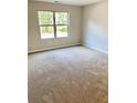 Spacious bedroom with neutral wall paint and carpeted floors at 478 Charleston Pl, Villa Rica, GA 30180