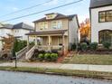 Two-story craftsman style home with front porch and landscaping at 627 Mead Se St, Atlanta, GA 30312