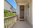 Inviting front porch with a wooden door and railing, showcasing curb appeal at 627 Mead Se St, Atlanta, GA 30312