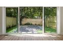 View of backyard through sliding glass doors at 622 Bellemeade Nw Ave # 9, Atlanta, GA 30318