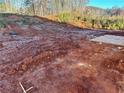 Partially cleared lot with red clay soil, ready for construction at 482 Charleston Pl, Villa Rica, GA 30180