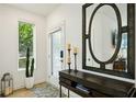Bright entryway with large mirror, console table, and cactus plant at 403 Pratt Se Dr # 1009, Atlanta, GA 30315