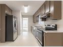 Galley kitchen with stainless steel appliances at 2895 Ivy Mill Dr, Buford, GA 30519