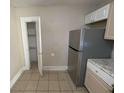 Kitchen features stainless steel refrigerator and pantry at 1294 N Avenue Nw, Atlanta, GA 30318