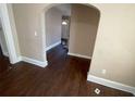 Spacious living room with hardwood floors and arched entryway at 1294 N Avenue Nw, Atlanta, GA 30318