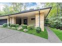 Modern home with stone pillars and a landscaped walkway at 4373 Wieuca Ne Rd, Atlanta, GA 30342