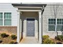 Gray front door with sidelights and a covered entryway at 585 Mcwilliams Se Rd # 807, Atlanta, GA 30315