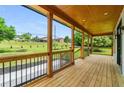 Front porch with wooden flooring and view of the neighborhood at 4107 Old Suwanee Rd, Buford, GA 30518